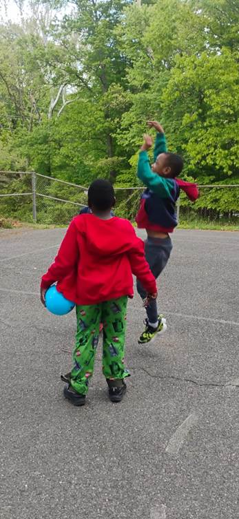 Youth playing basketball